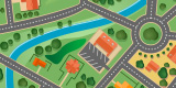 Colorful illustrated map of a neighborhood showing roads, a roundabout, houses, trees, a river, and a few buildings with parking lots.