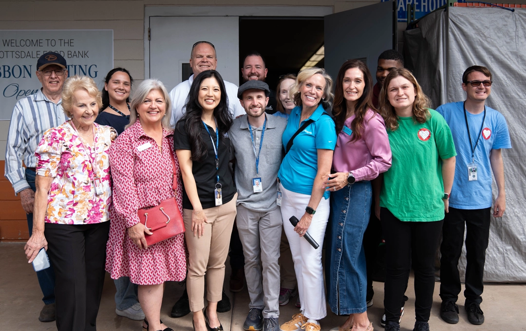 News image Staff, volunteers and councilmembers standing in front of new food bank doors