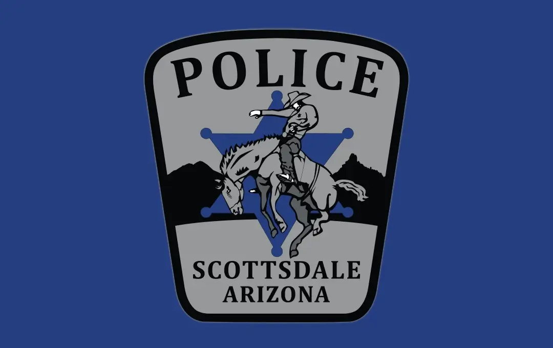 Gray police badge logo featuring a horse‑and‑rider graphic in front of a star shape with the words “Police Scottsdale Arizona.”