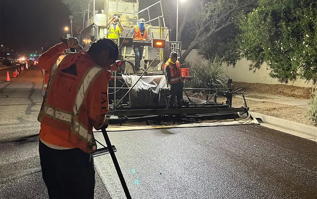 workers repaving a street