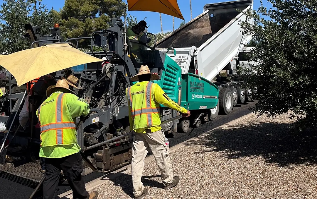 workers repaving a street