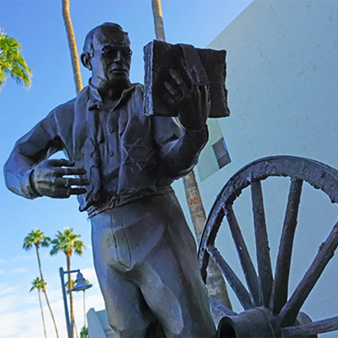 statue of military chaplain reading from the bible